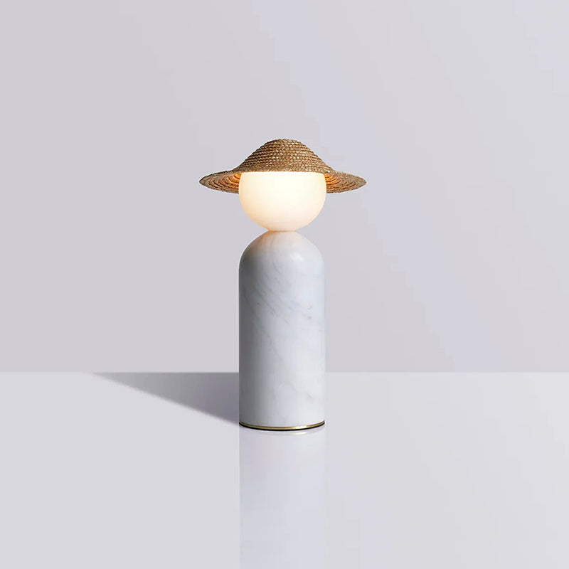 The yellow color variant of the Theros Table Lamp's rattan shade.