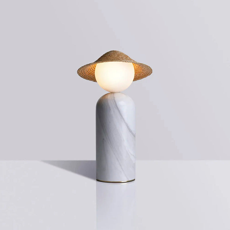The white color variant of the Theros Table Lamp's rattan shade.