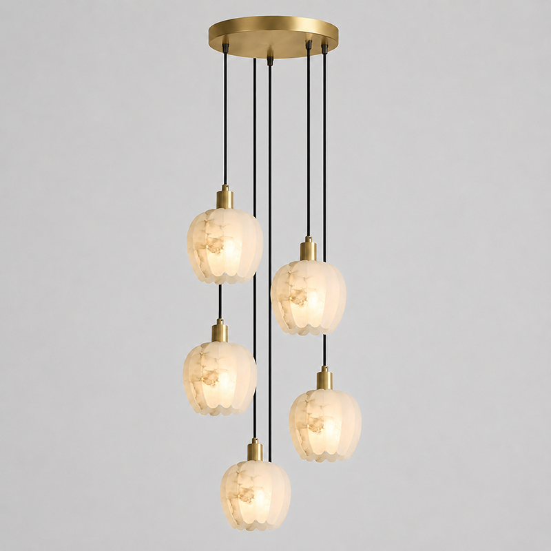 The brass body and hardware of the chandelier.
