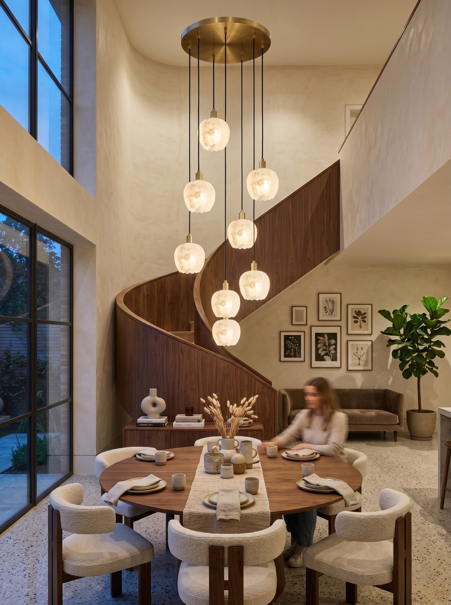 The Lilin Chandelier installed over a spiral staircase.
