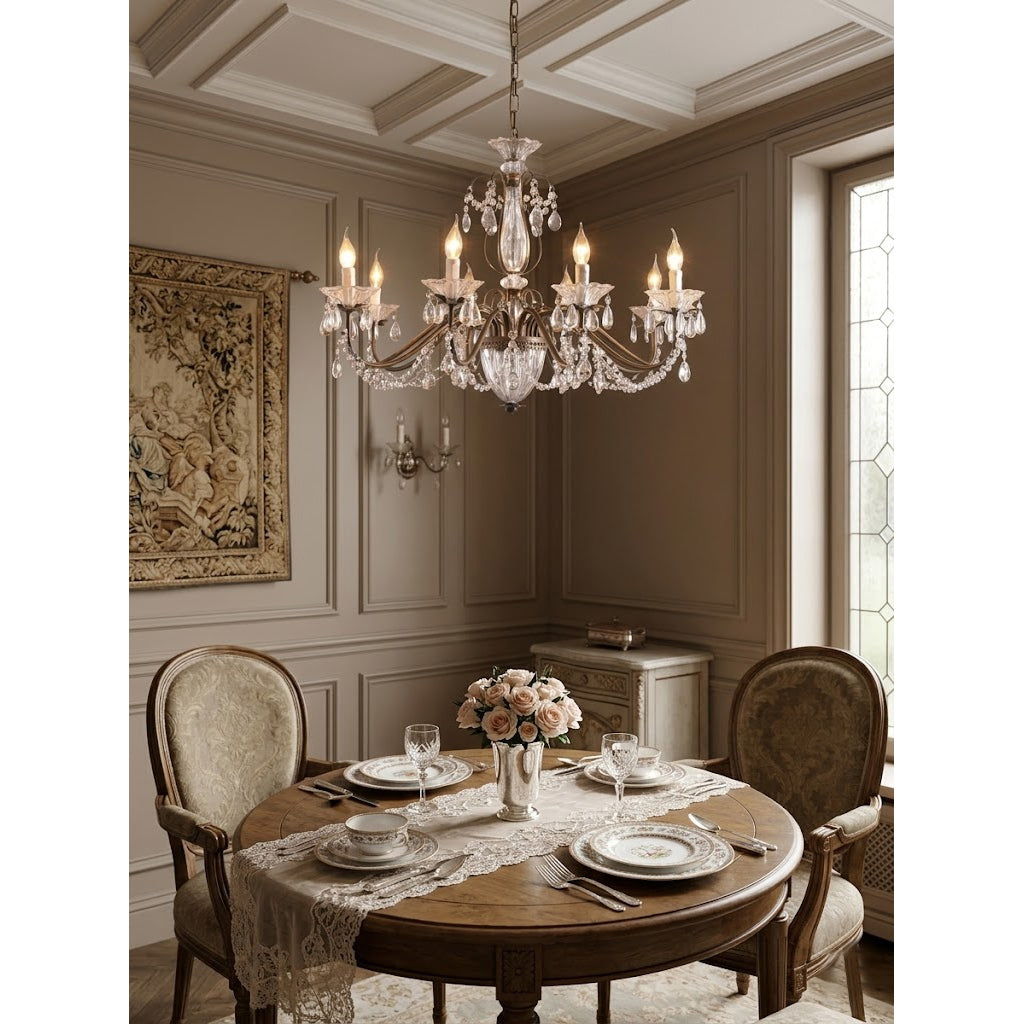 Close-up on a single candelabra-style light with its clear glass shade.