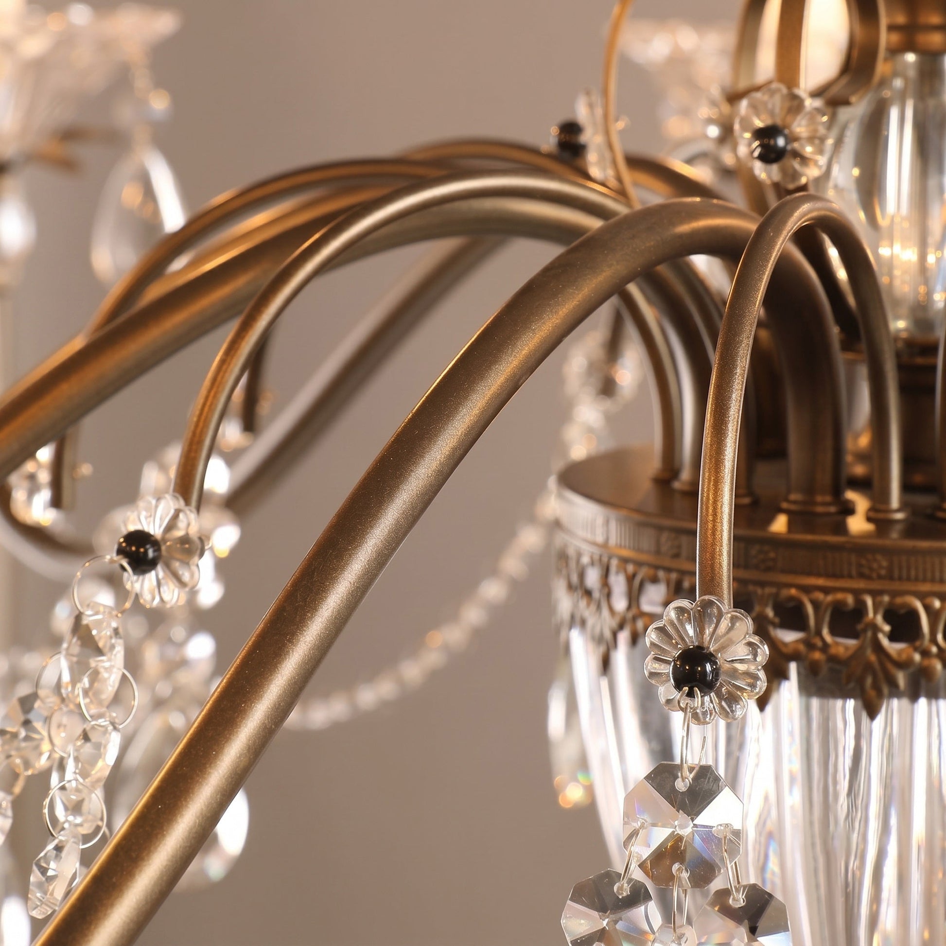 The clear glass shades on the candelabra sockets, ready for bulbs.