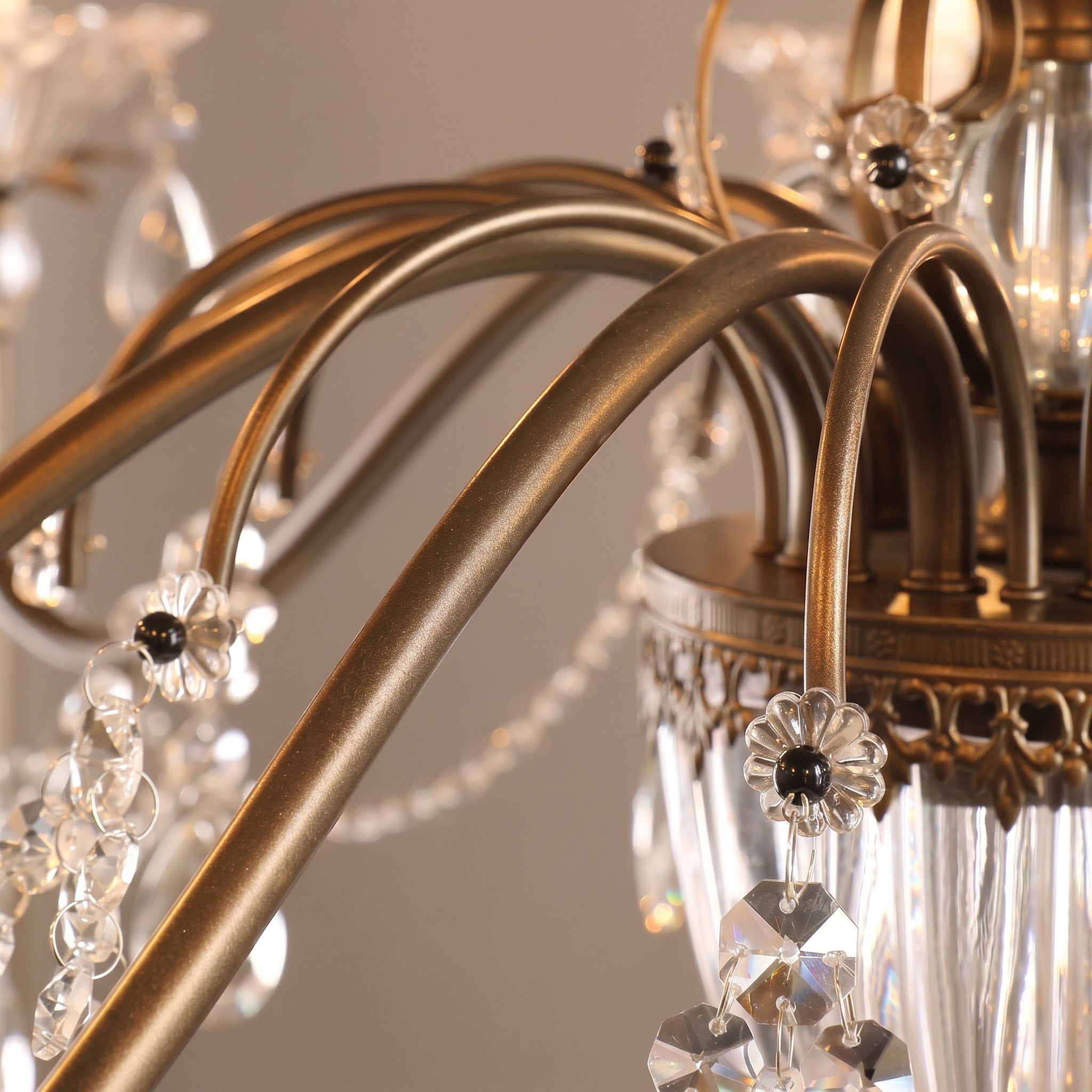 The clear glass shades on the candelabra sockets, ready for bulbs.