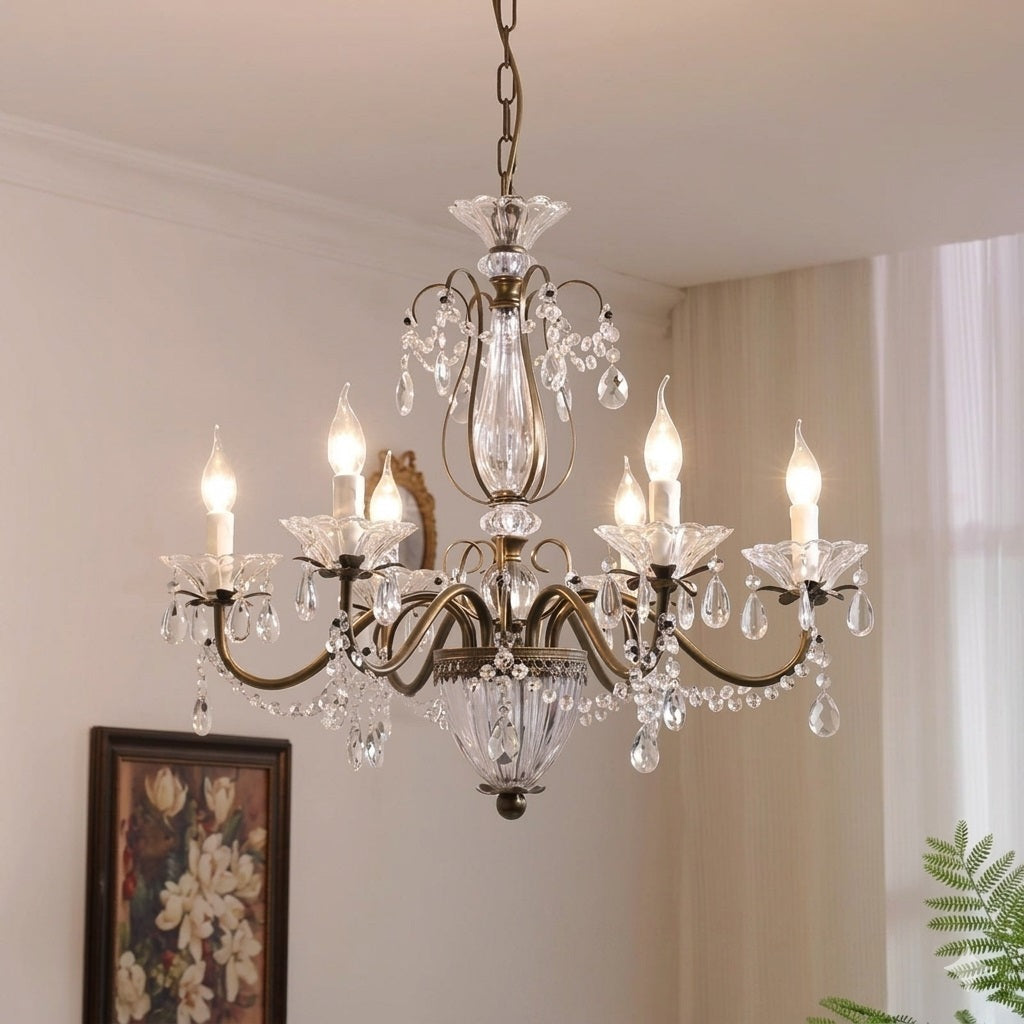 Close-up of the antique brass finish and crystal details on the Venatici Chandelier.