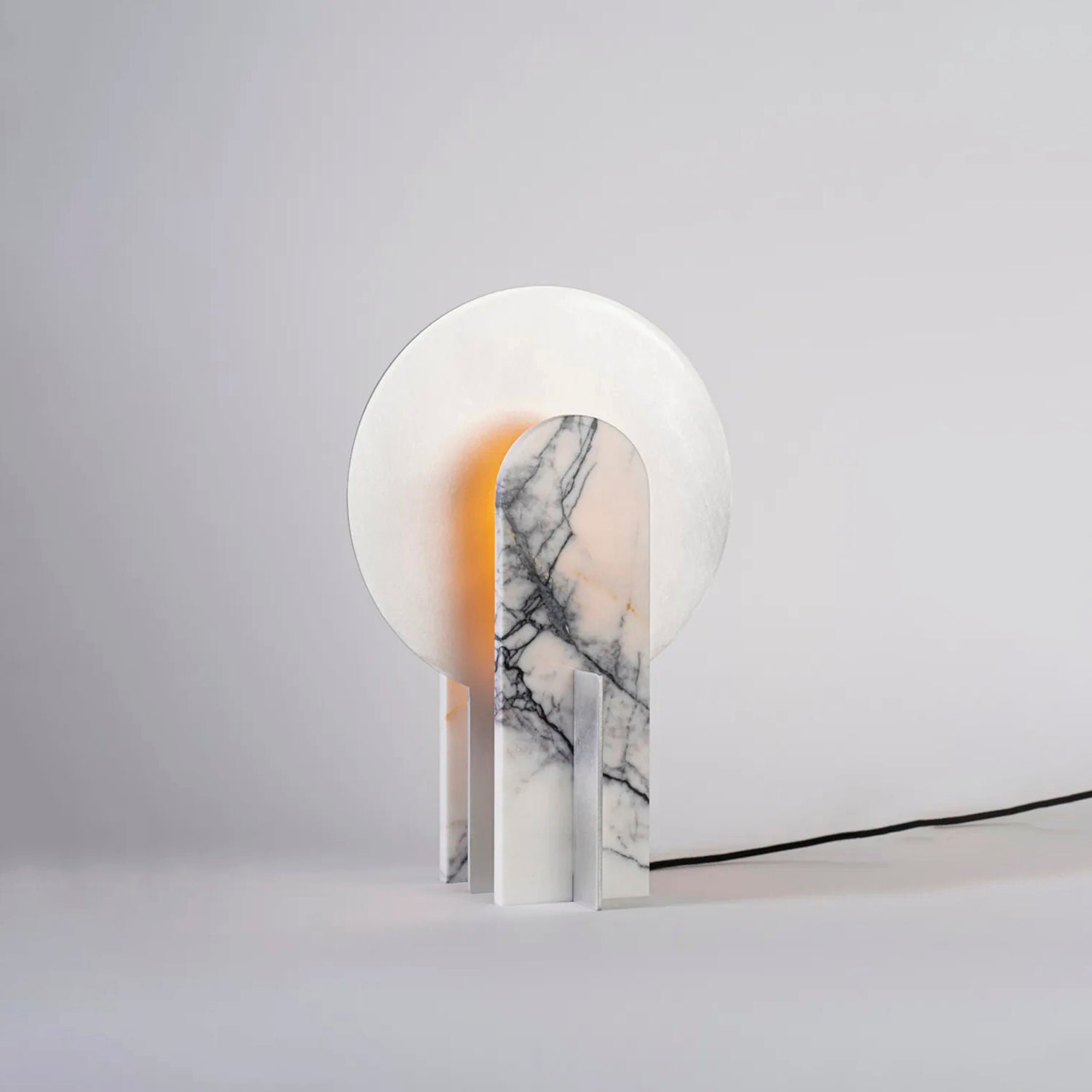 The Alice Table Lamp in a dimly lit room to showcase its mood lighting effect.
