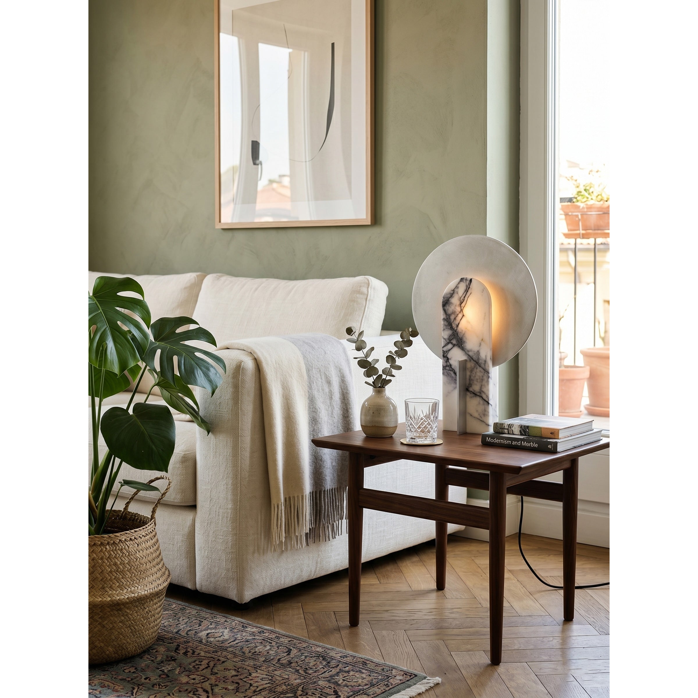 Side view of the sculptural Alice Table Lamp, showing its arced design.