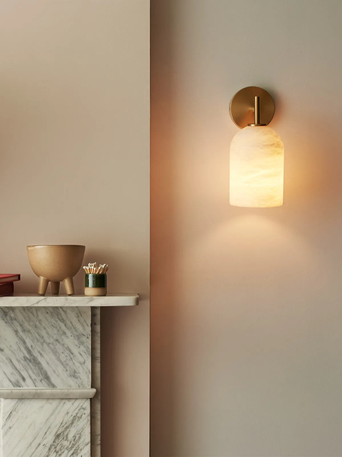 Close-up of the natural veining on the alabaster shade of the Rae Wall Lamp.