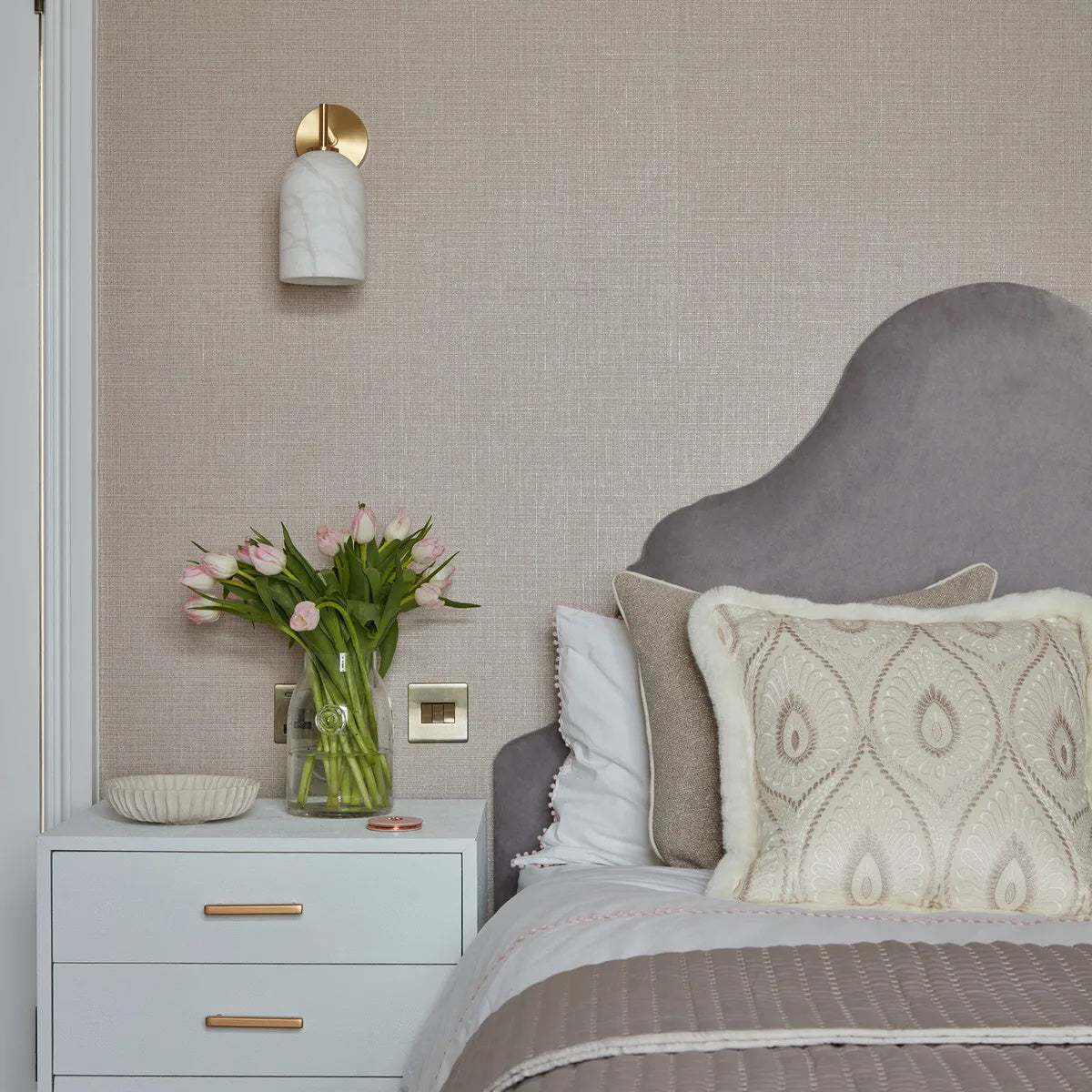 Detail shot of the gold metal fixture on the Rae Alabaster Wall Lamp.