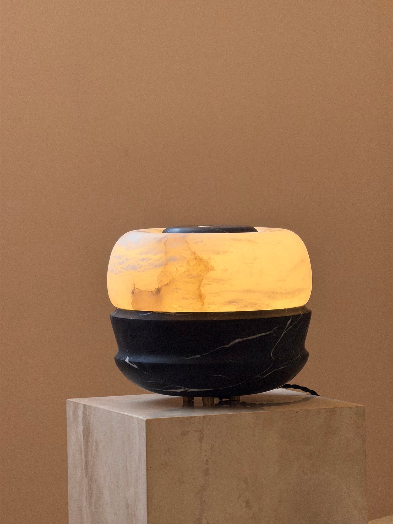 The Ramson lamp with the light turned off, showing the marble's detail.