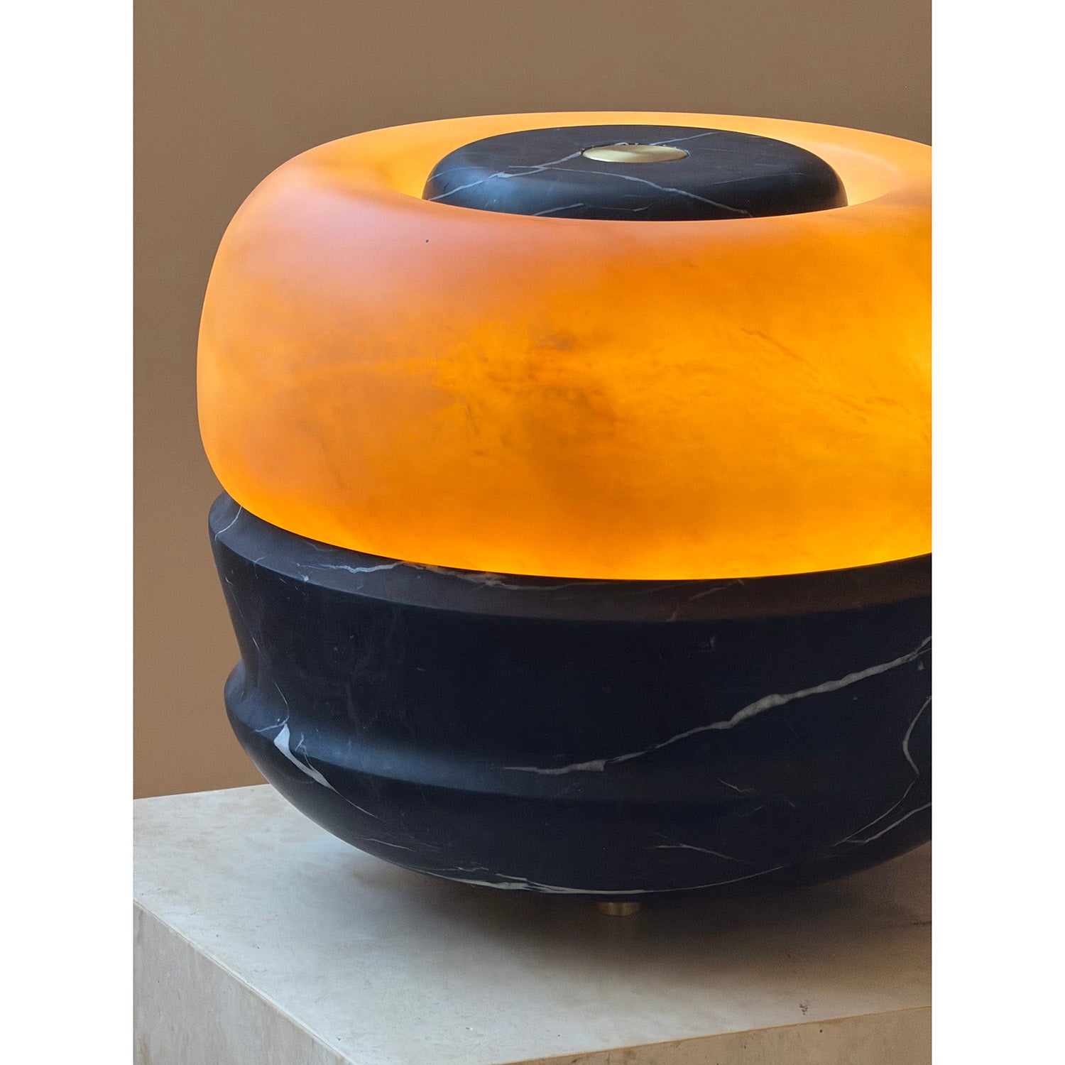 Angled view of the black Ramson Stone Table Lamp.