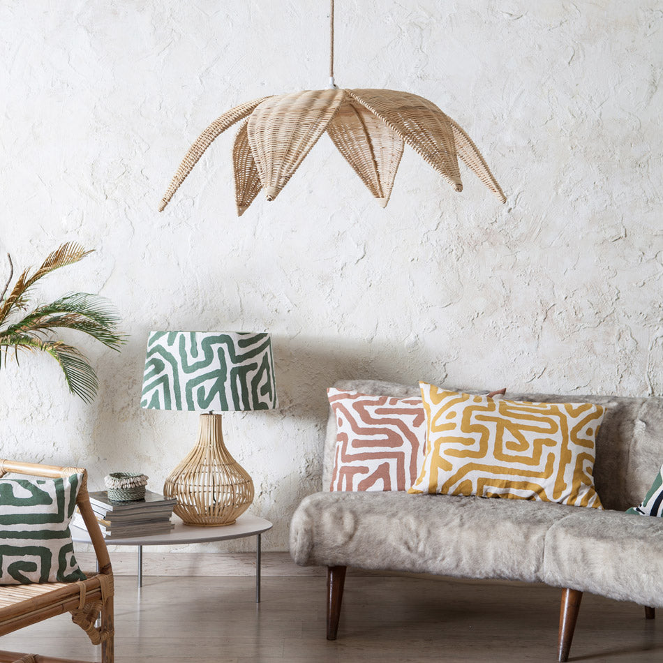 Close-up view of the hand-woven rattan leaves detail of the pendant lamp.