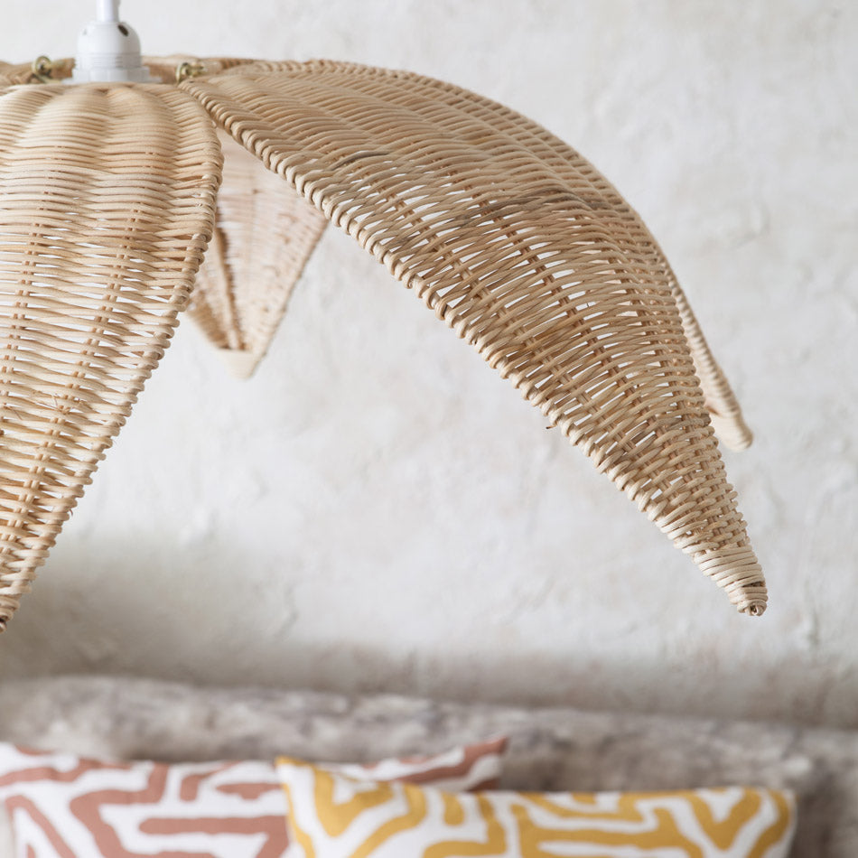The lamp complementing a biophilic interior design with lush green plants.