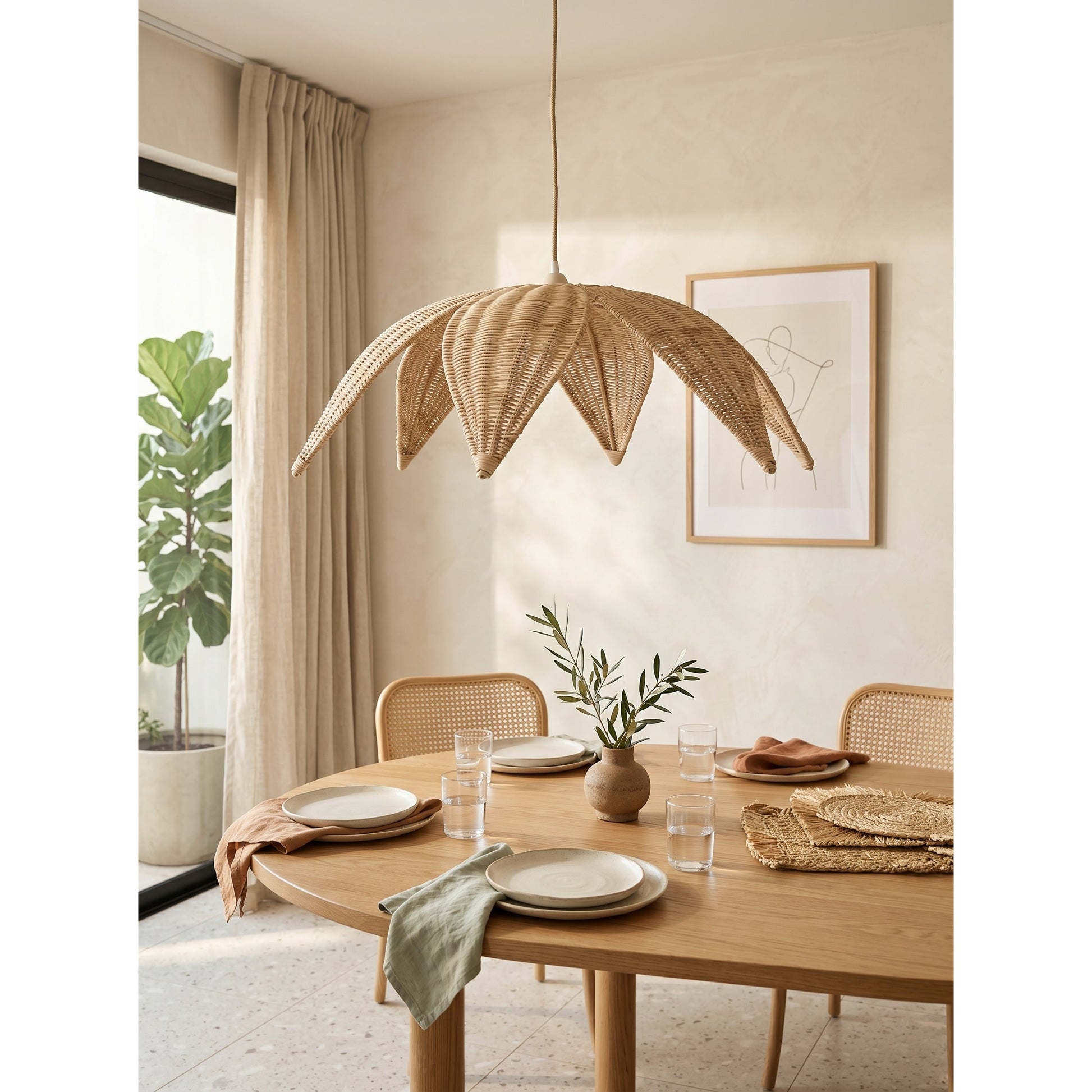 The pendant lamp as a statement piece over a wooden kitchen island.