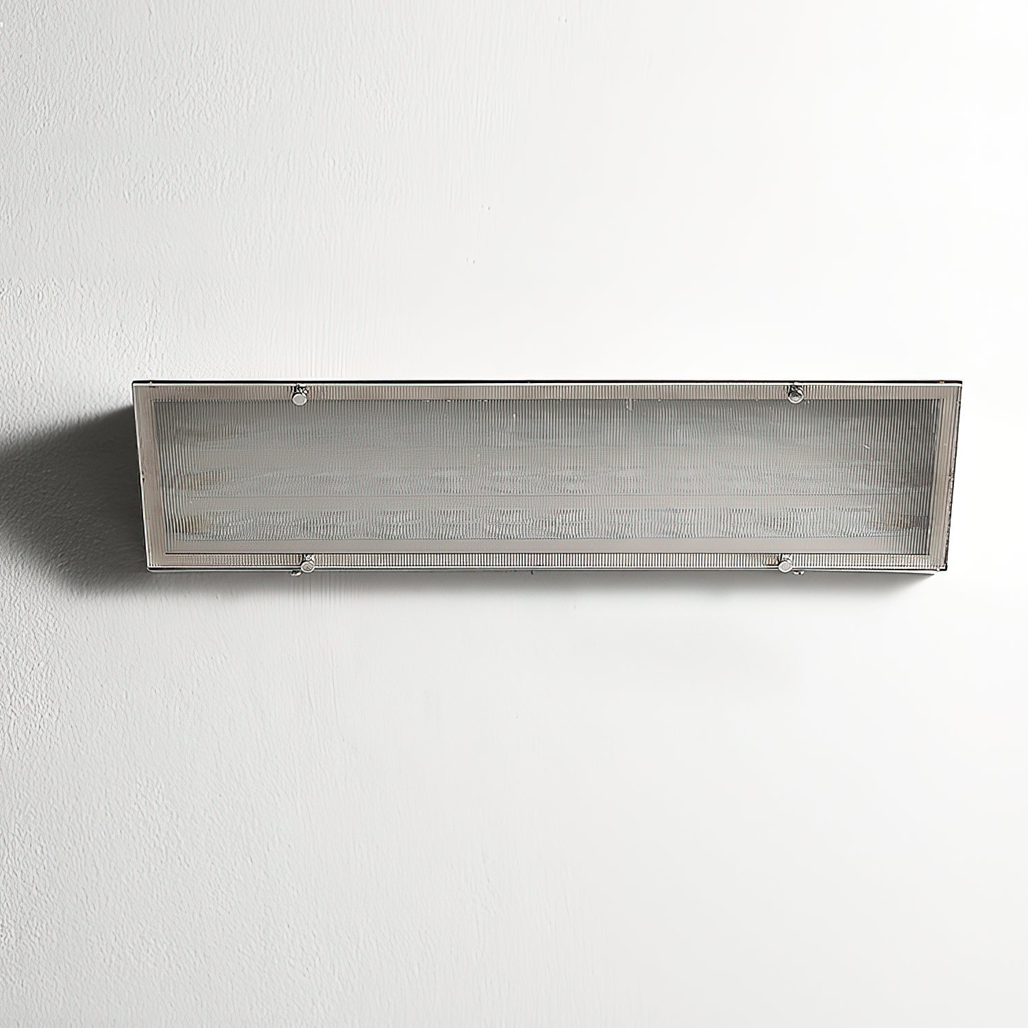 The Recbox Wall Lamp shown in a hallway for scale.