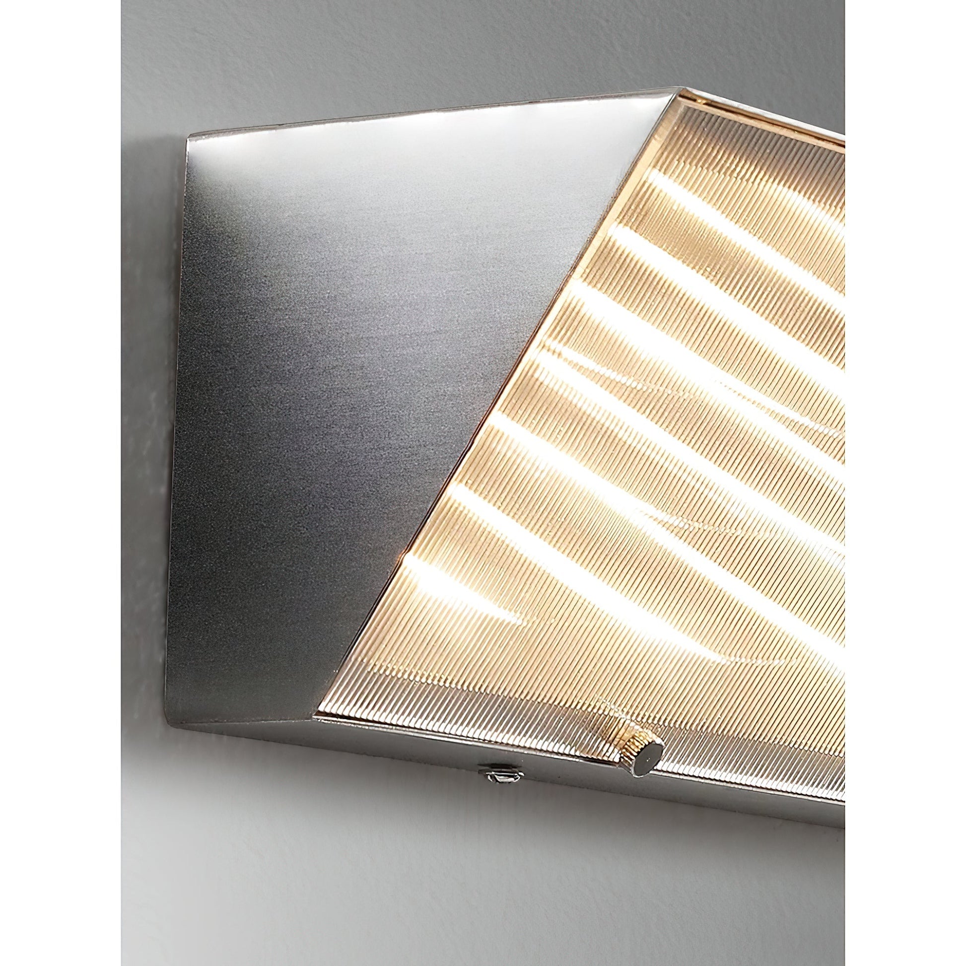 Lifestyle image of the Recbox Wall Lamp above a console table.