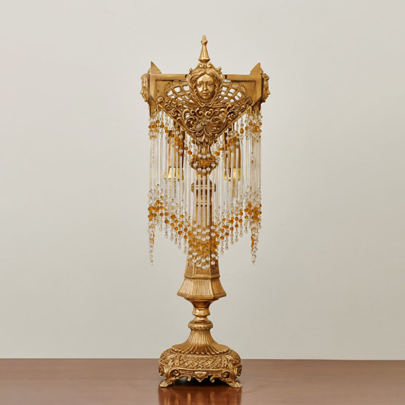 The lamp against a dark background to highlight the brass finish.