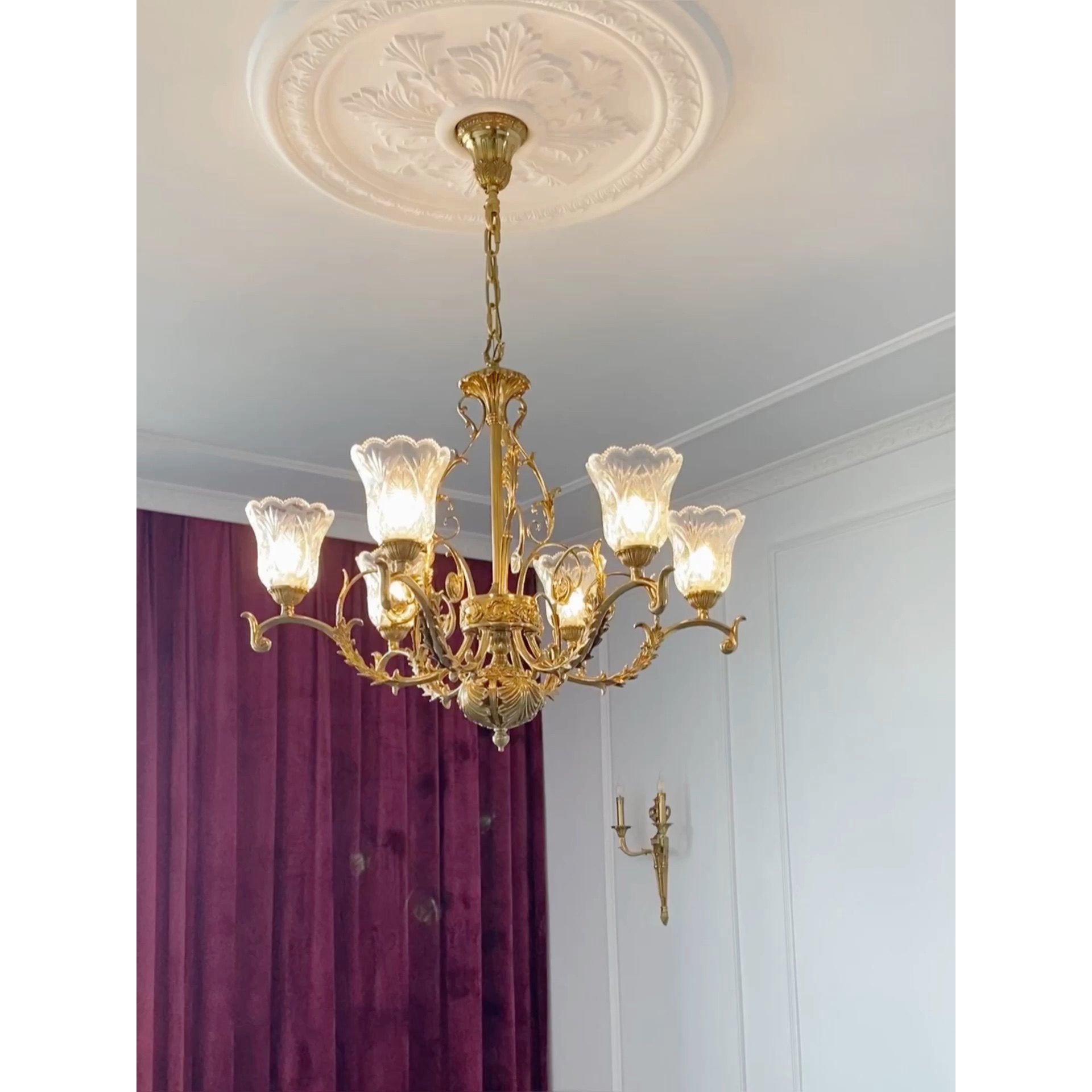 The chandelier with lights off, highlighting the materials.