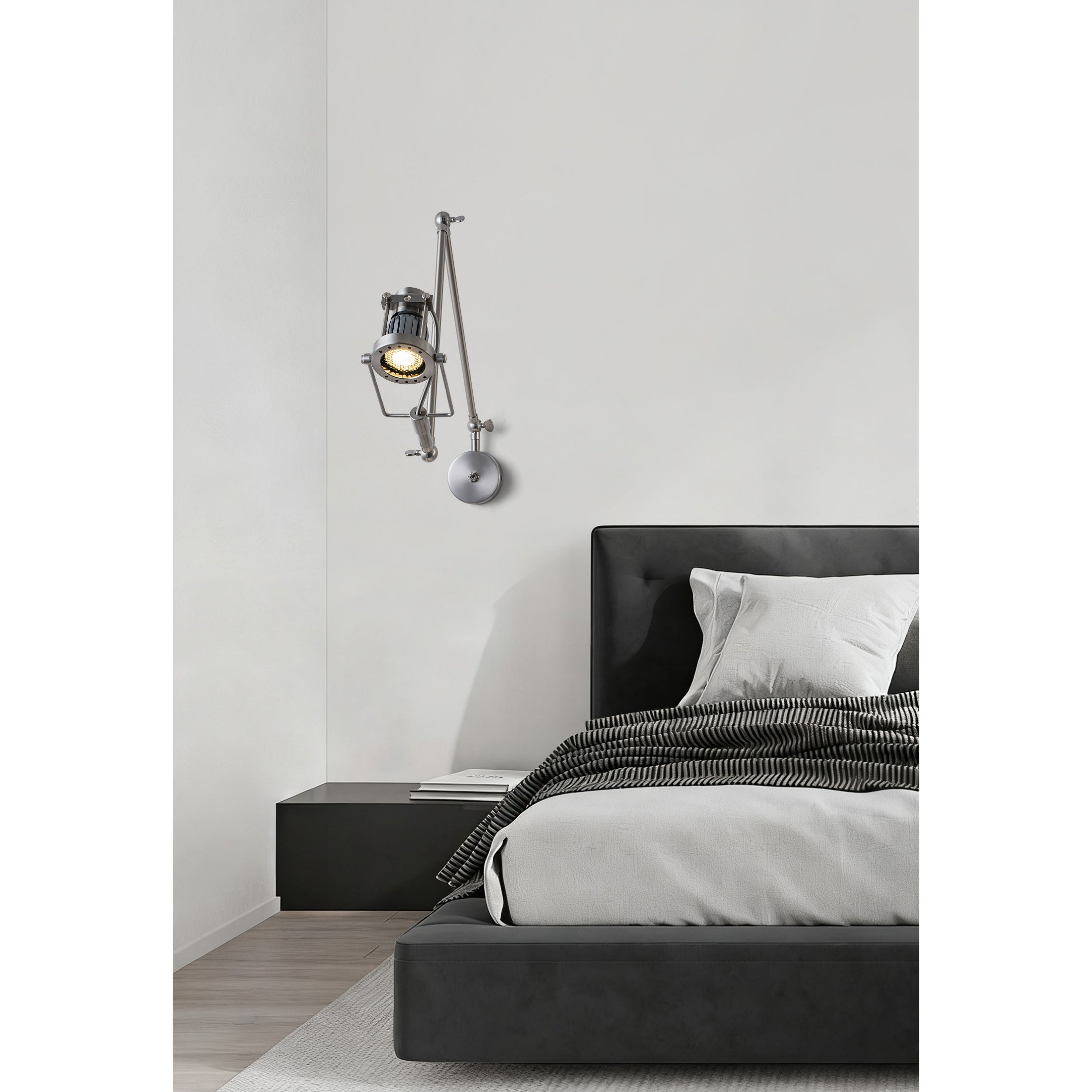 Lifestyle image of the Reznor sconce illuminating a reading nook.