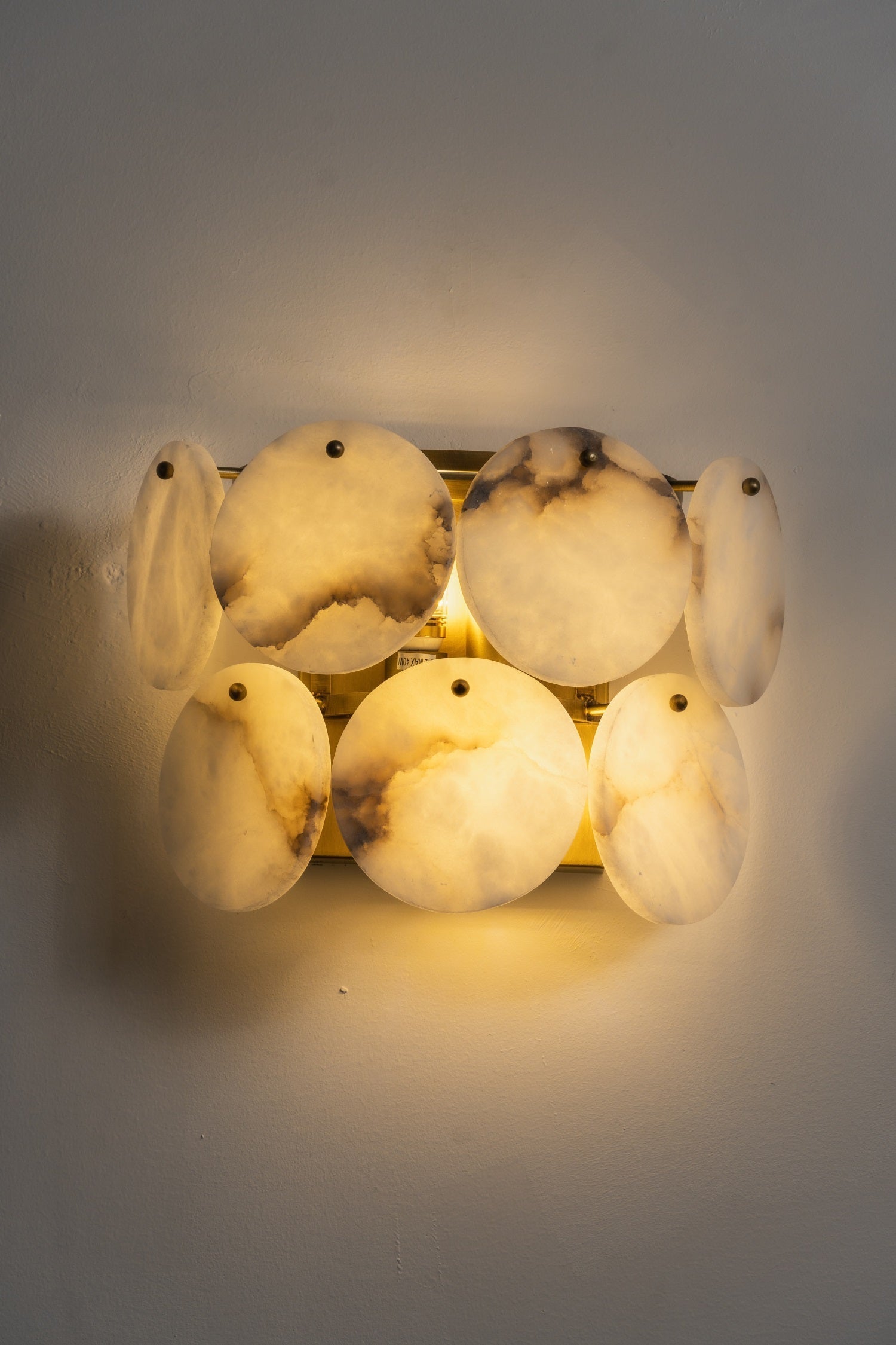 Riviera Alabaster Wall Lamp in a minimalist interior.
