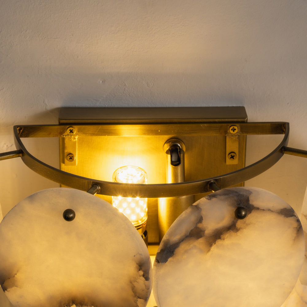 The wall lamp as a pair on either side of a mirror.