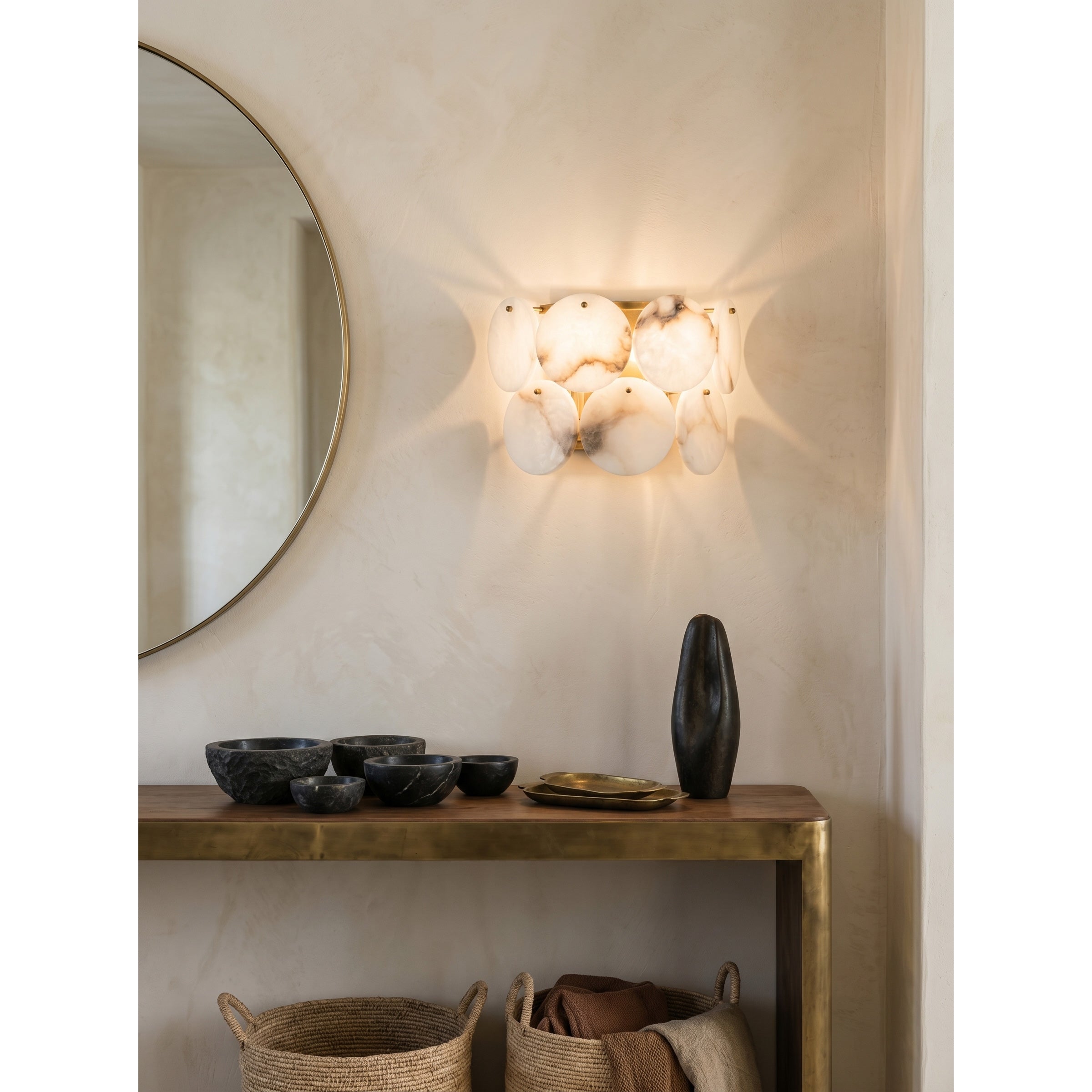 The wall lamp illuminated, casting a warm glow.