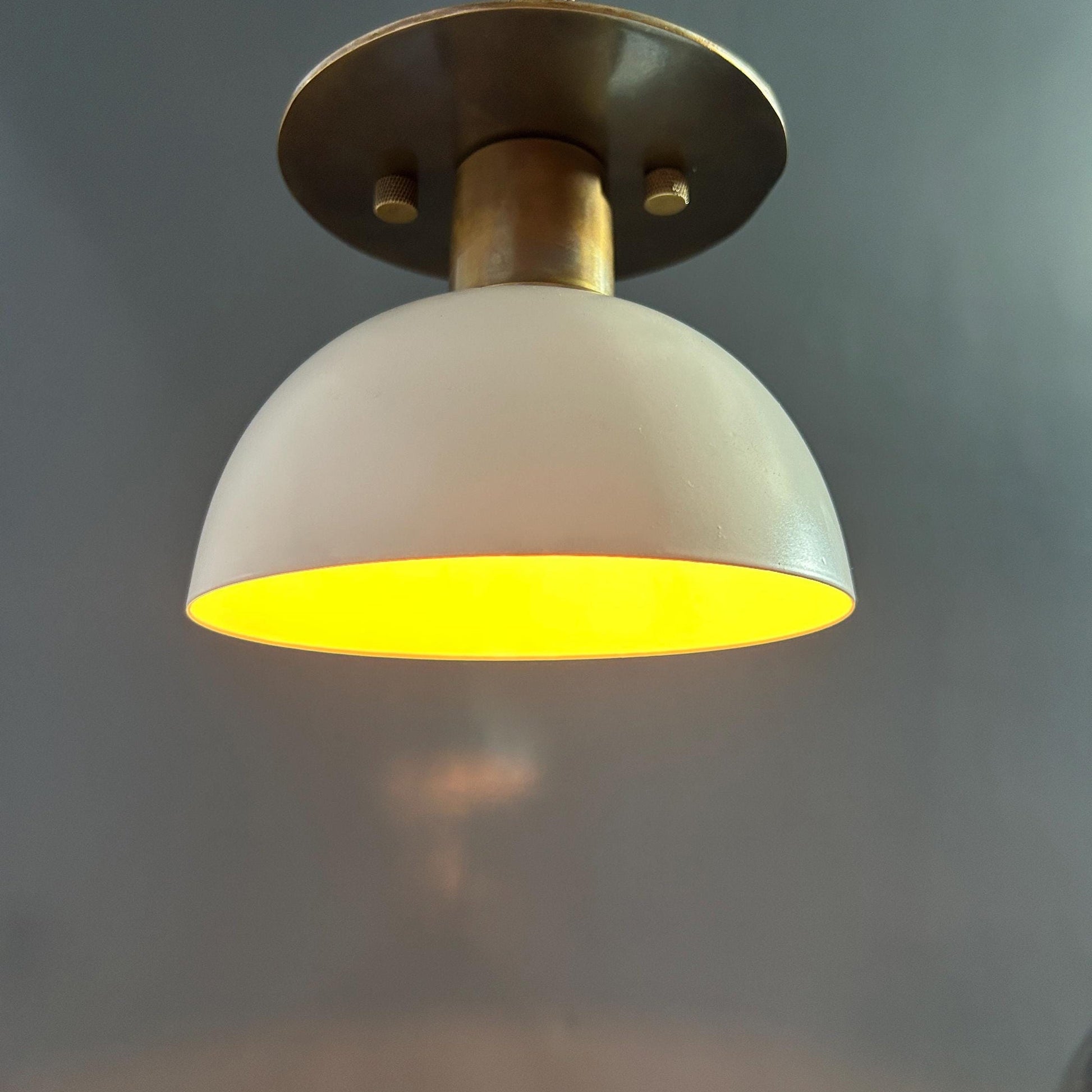 The Rodanthe Ceiling Lamp turned on, casting a warm glow.