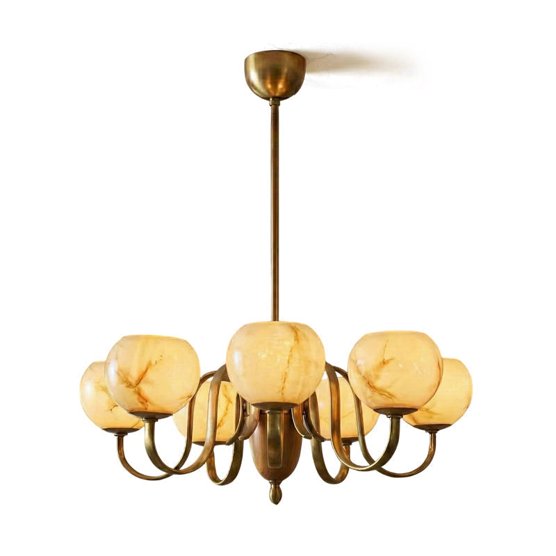 The Linnea Chandelier against a dark wall to highlight its form and materials.