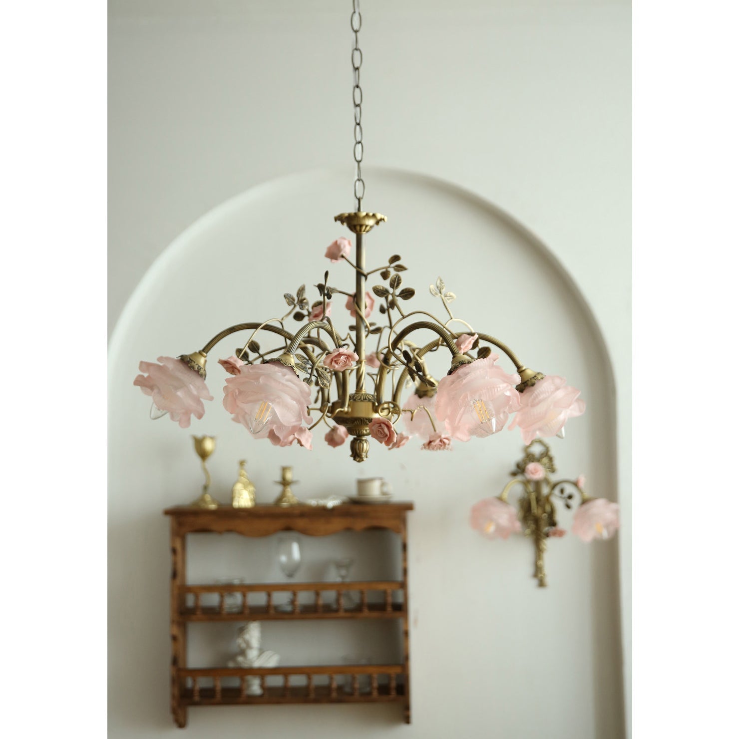 Rosalie Chandelier shown in a romantic bedroom setting above a bed.