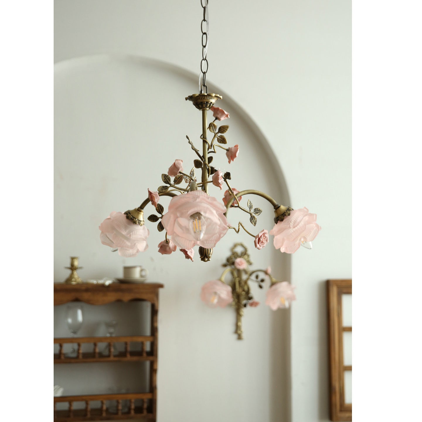 View of the chandelier from below, showing the arrangement of the rose-shaped lights.