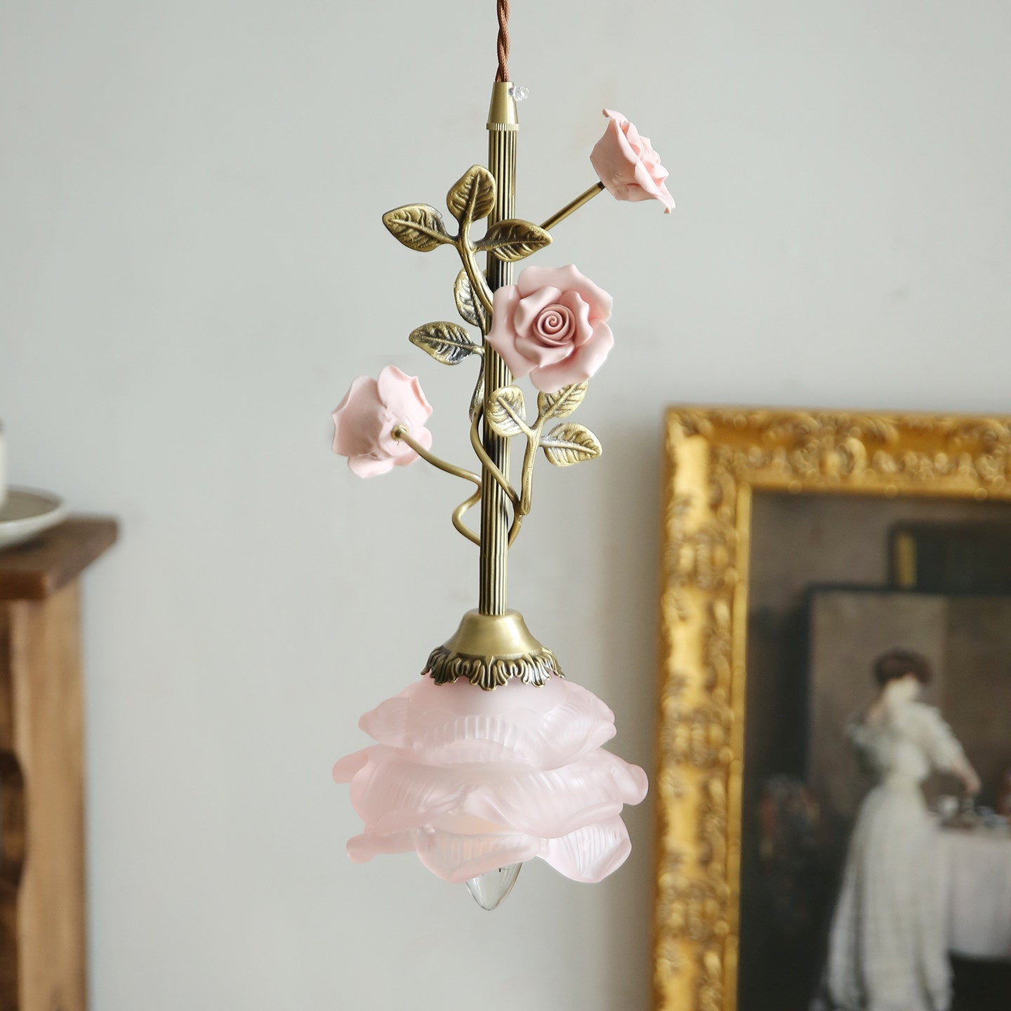 Close-up view of the frosted glass shade shaped like a rose.