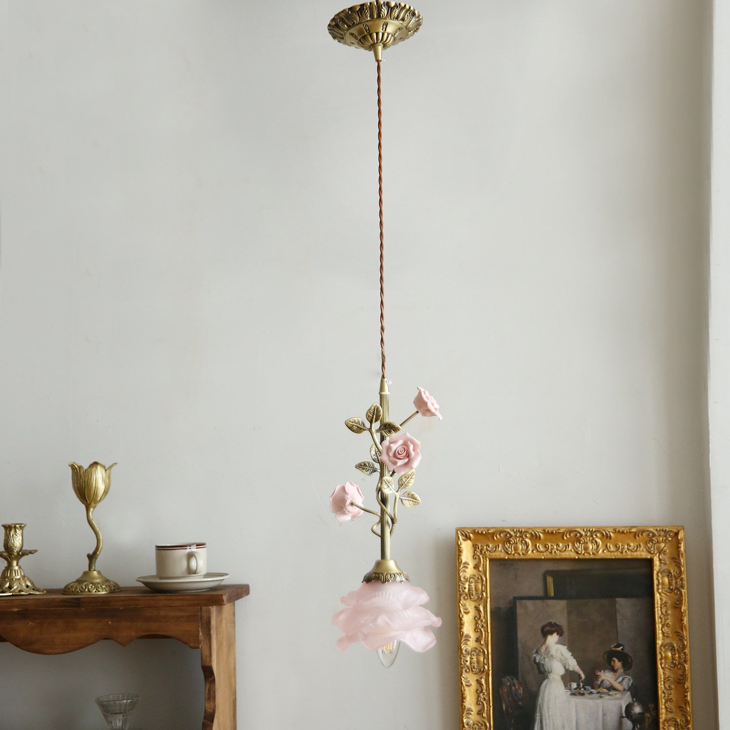 The pendant lamp hanging in a softly lit room.