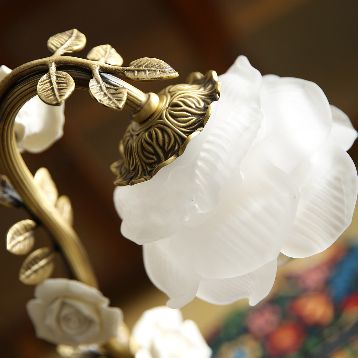 A lifestyle shot of the lamp on an end table next to a sofa.