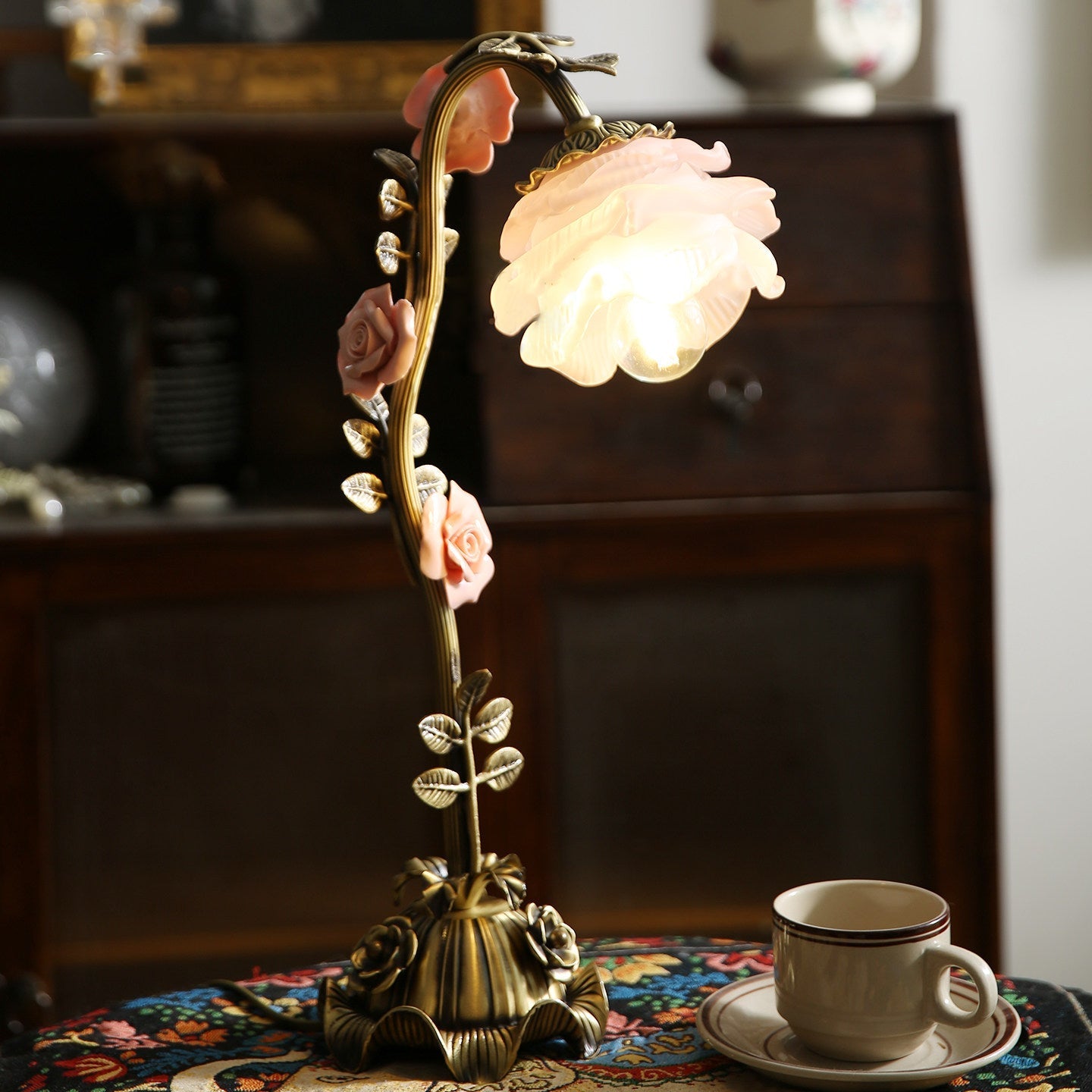 Close-up of the translucent glass rose shade of the Rosalie lamp.