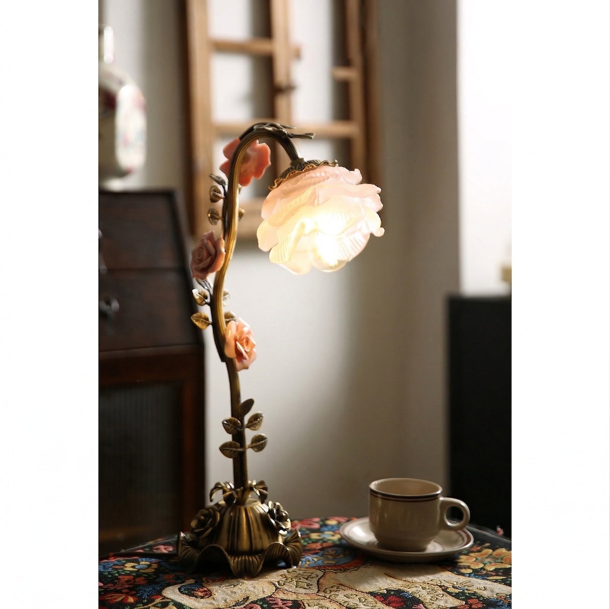 The Rosalie lamp in a living room setting, adding a decorative accent.