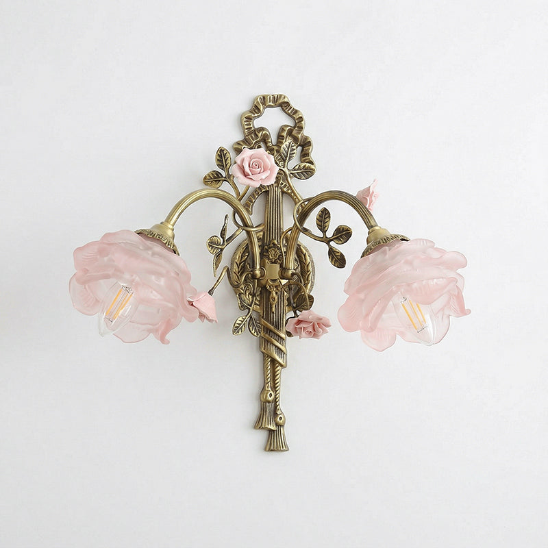 The Rosalie sconce from a low angle, highlighting the brass 'quiver' base.
