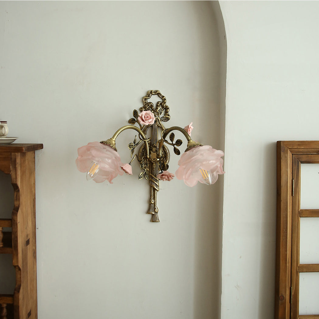 Side view of the single-head Rosalie floral sconce against a light wall.