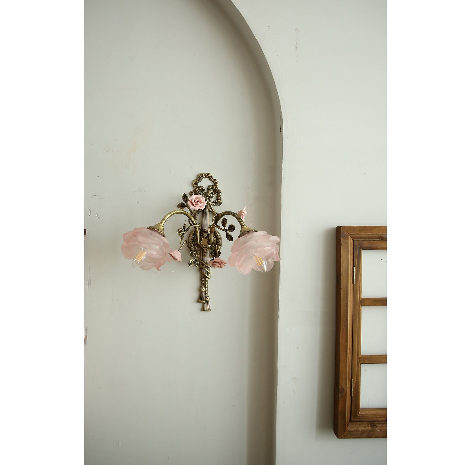 Front view of the two-head Rosalie floral sconce, showcasing its symmetrical design.