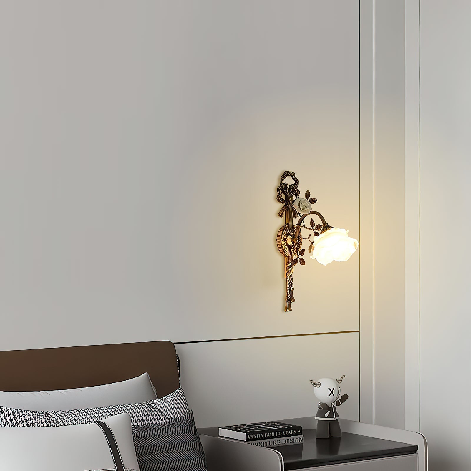 Detail of the brass arm and ceramic flower.
