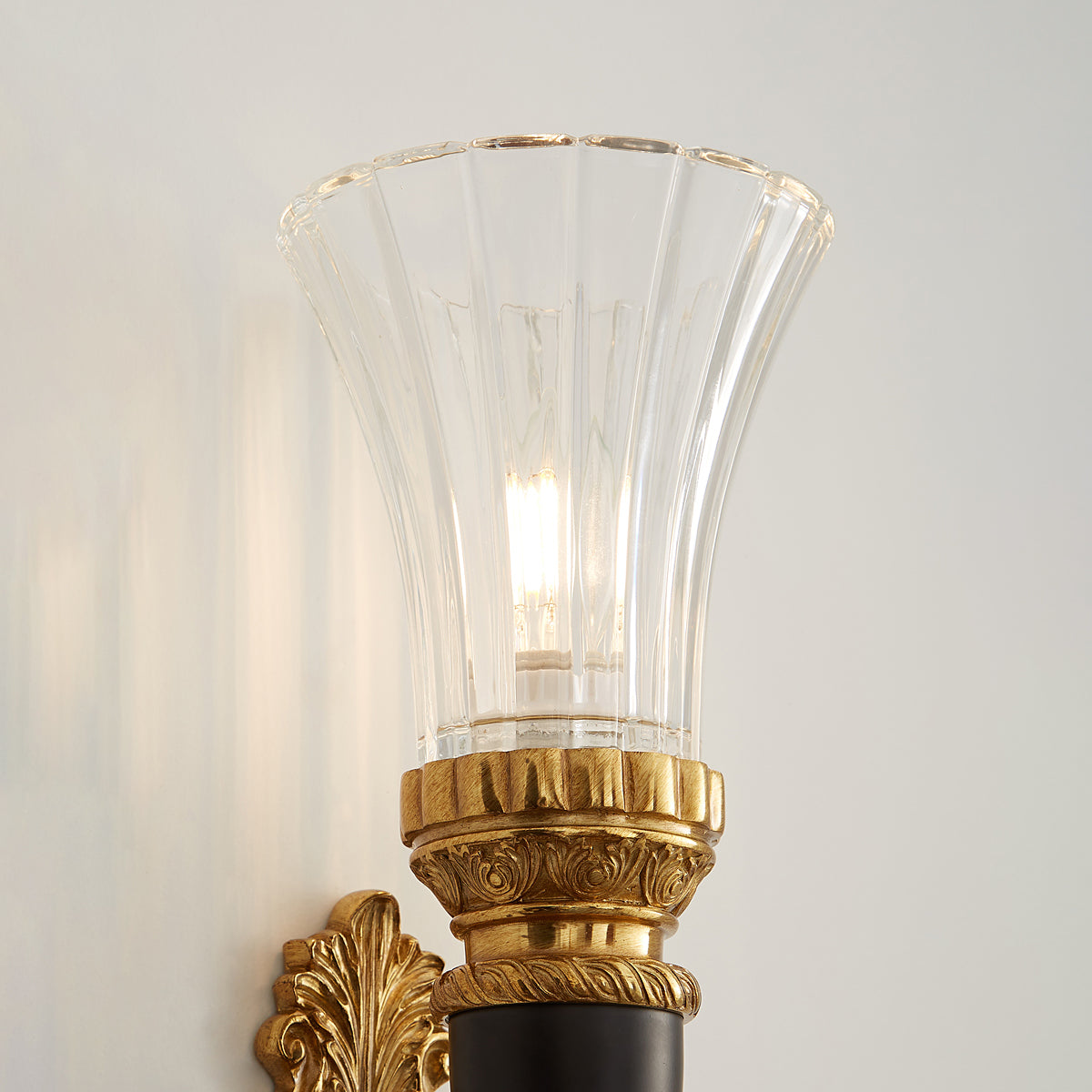 Rosalinda Torch Wall Lamp in a home entryway.