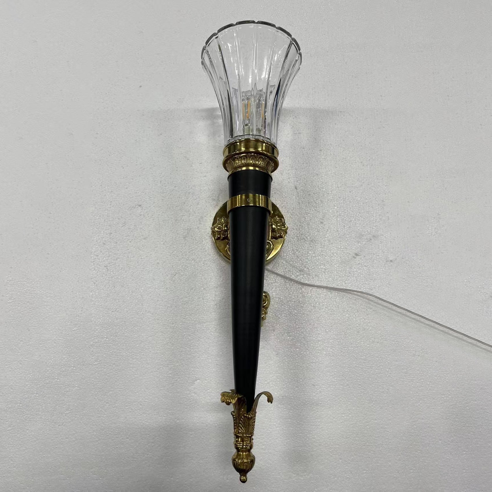 The lamp's brass and glass components.