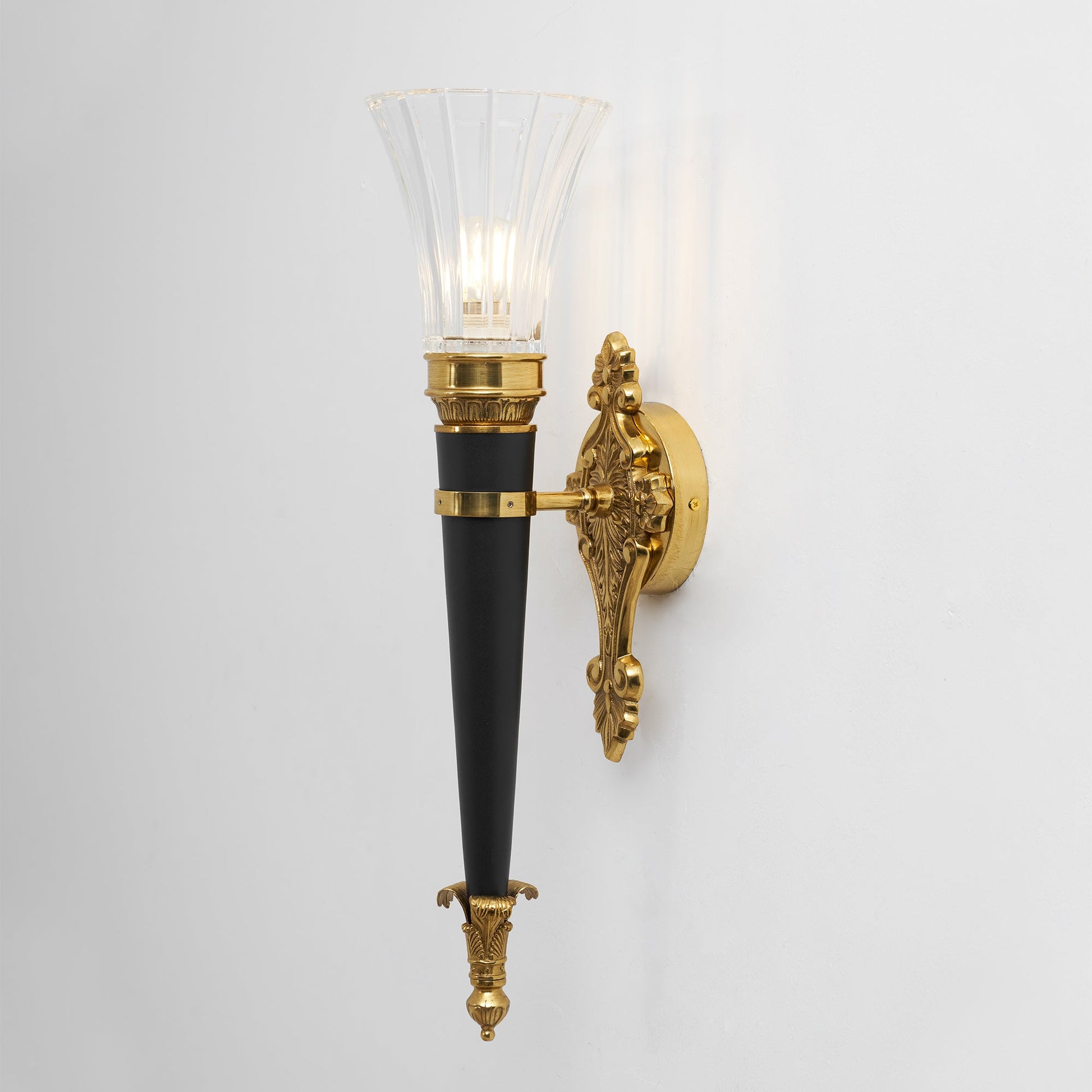 Rosalinda Torch Wall Lamp in a minimalist decor setting.