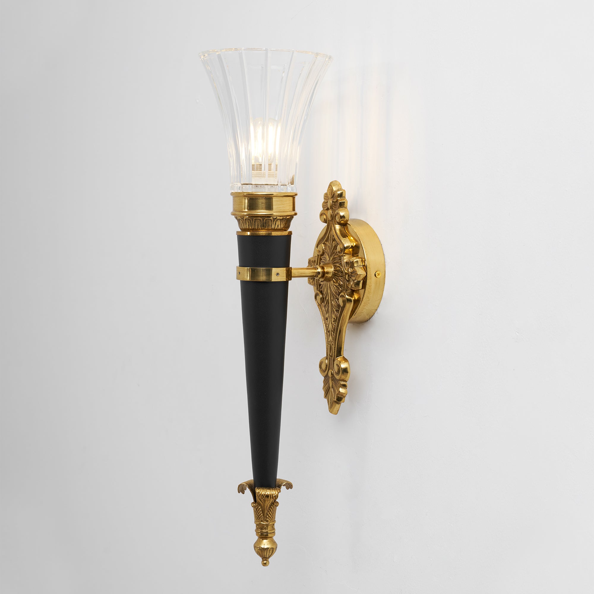 Rosalinda Torch Wall Lamp in a minimalist decor setting.