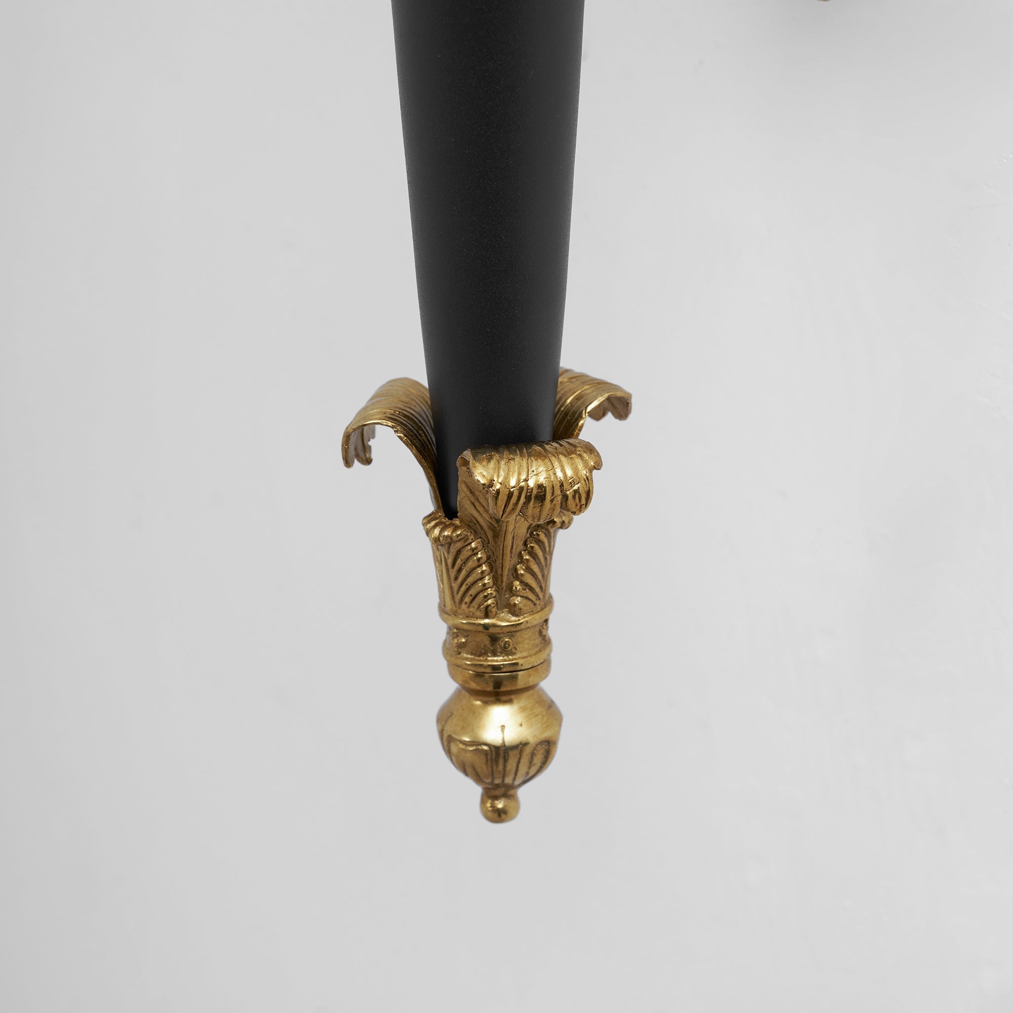 The Rosalinda Torch Wall Lamp shown with its light on.