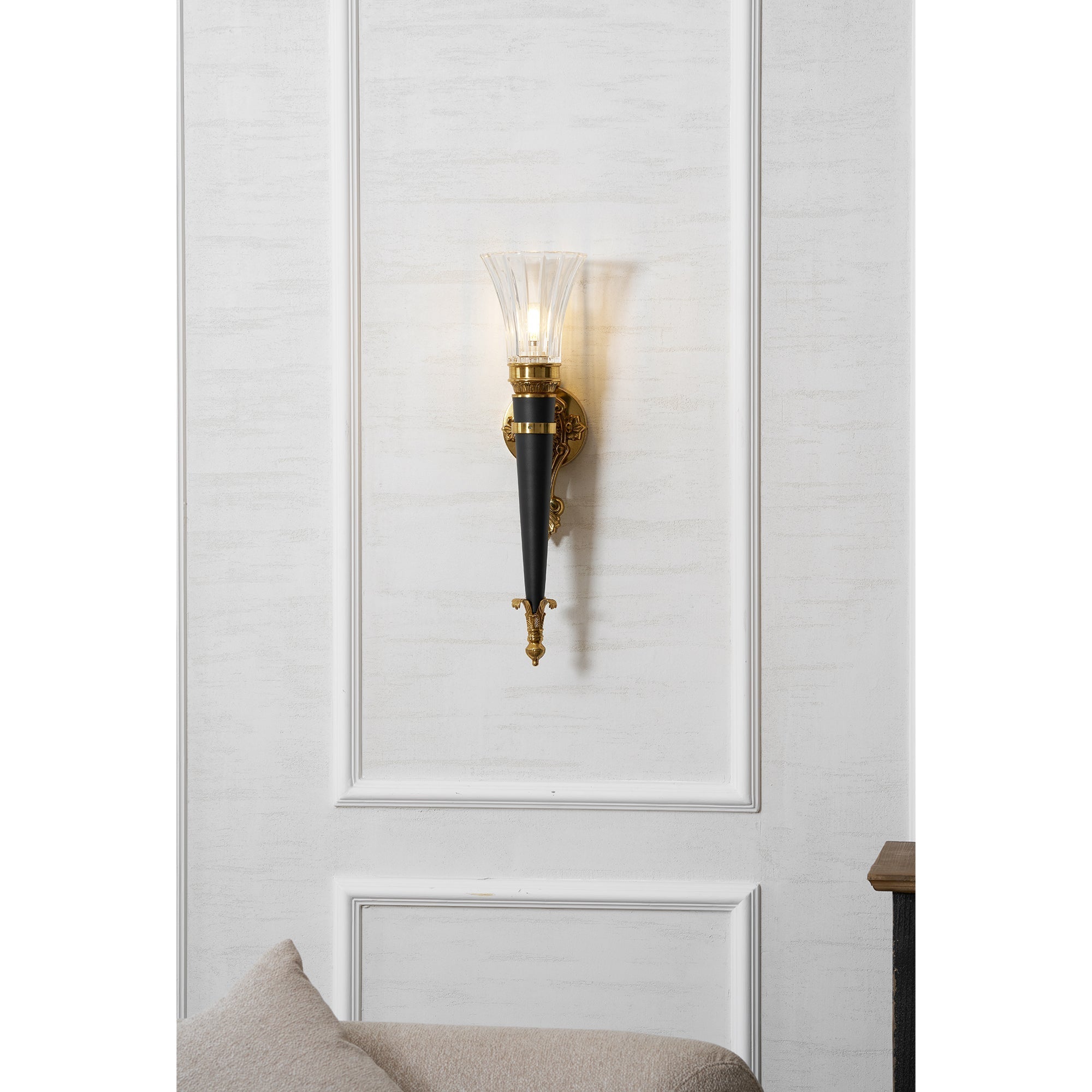 Rosalinda Torch Wall Lamp in a bedroom setting.