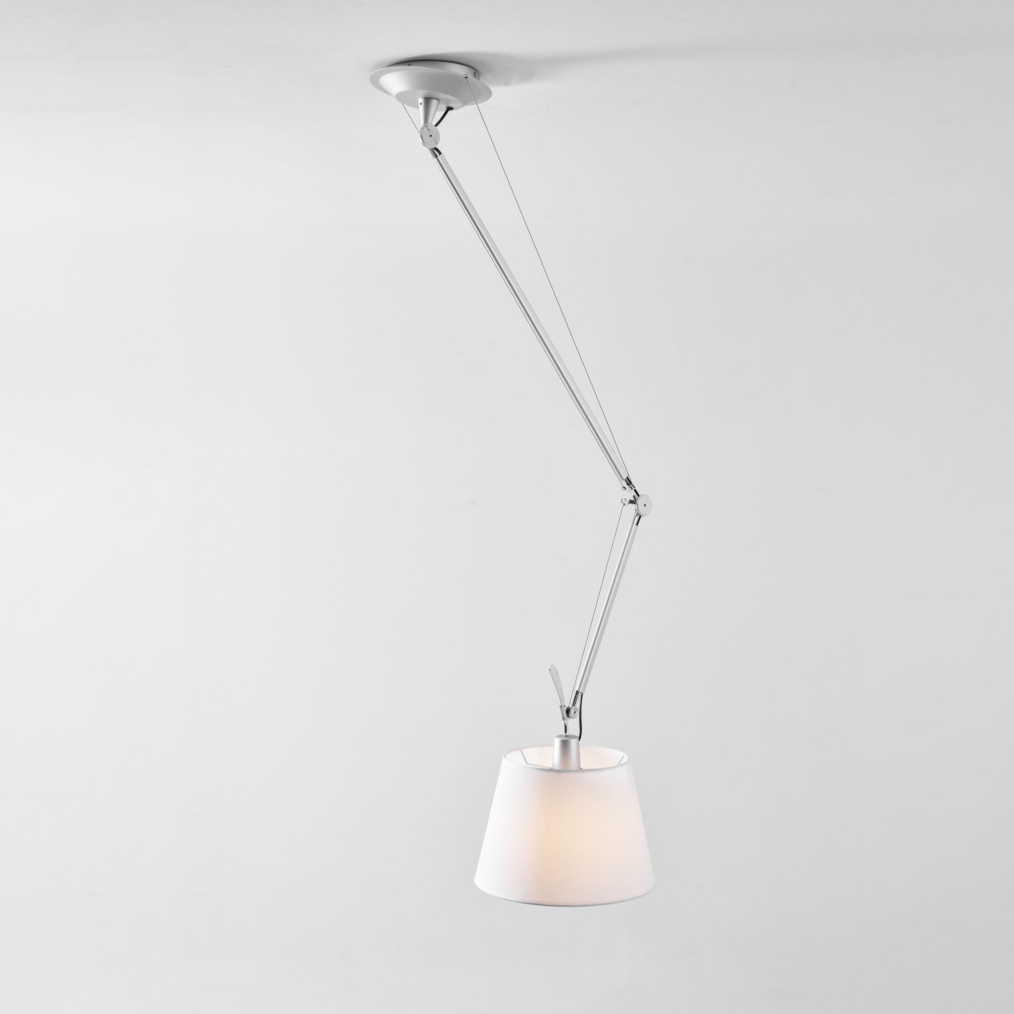 The adjustable arm of the lamp shown in a bent position.