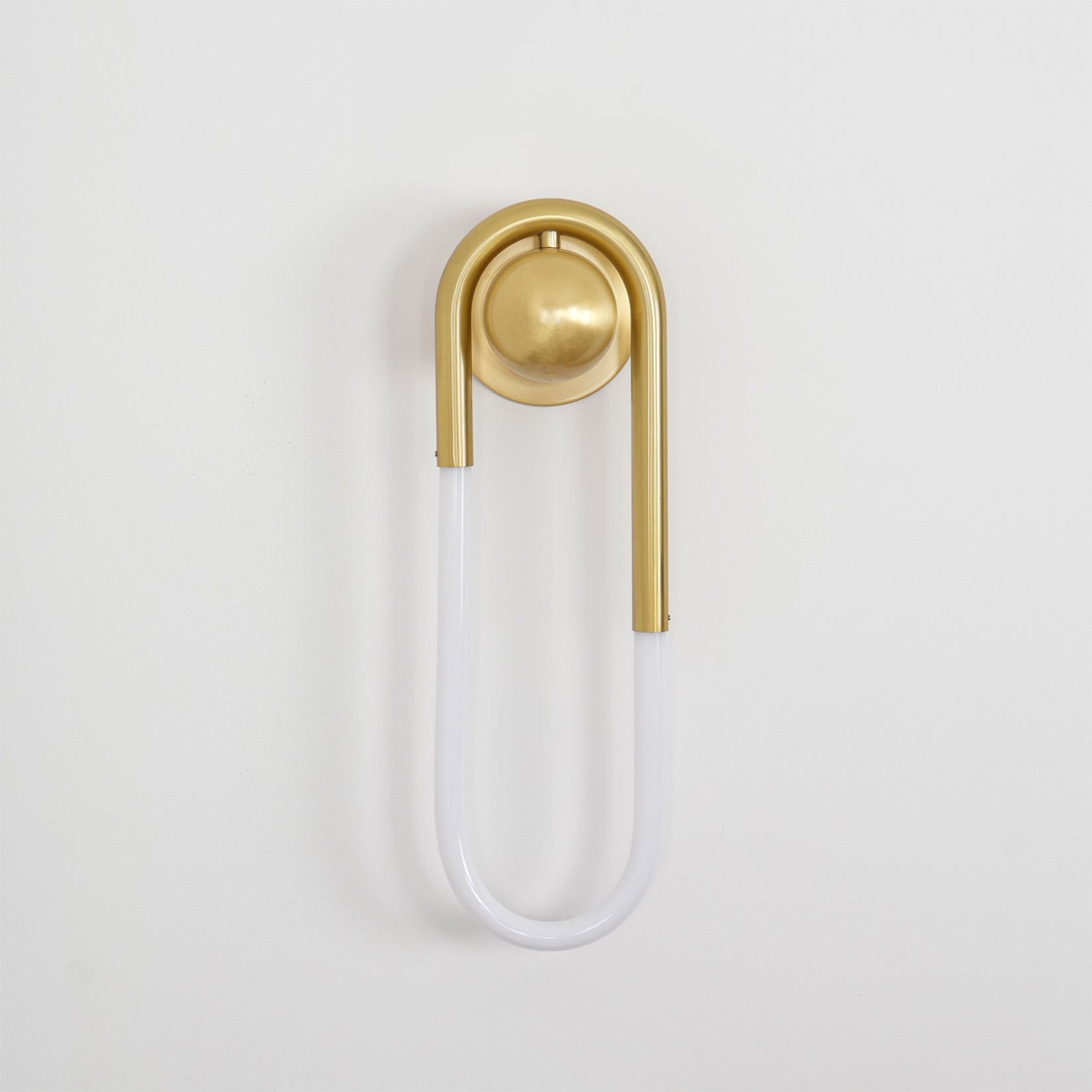 Rudi Loop Wall Lamp in white finish in a Scandinavian-style interior.