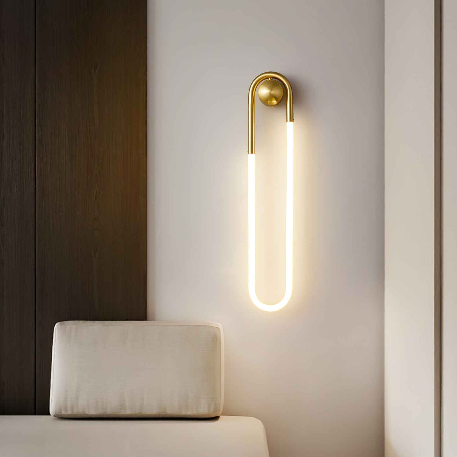 Rudi Loop Wall Lamp in white finish in a minimalist room.