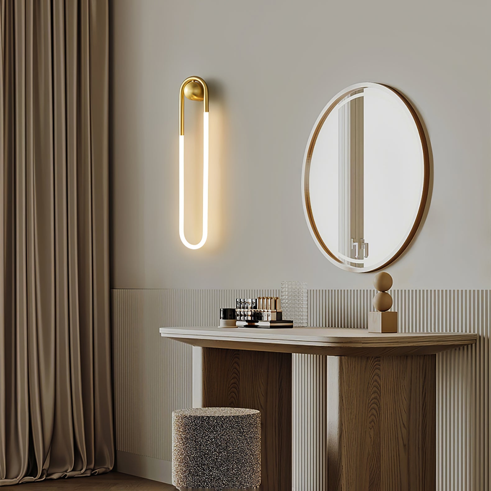 The white Rudi Loop Wall Lamp shown from a side angle.