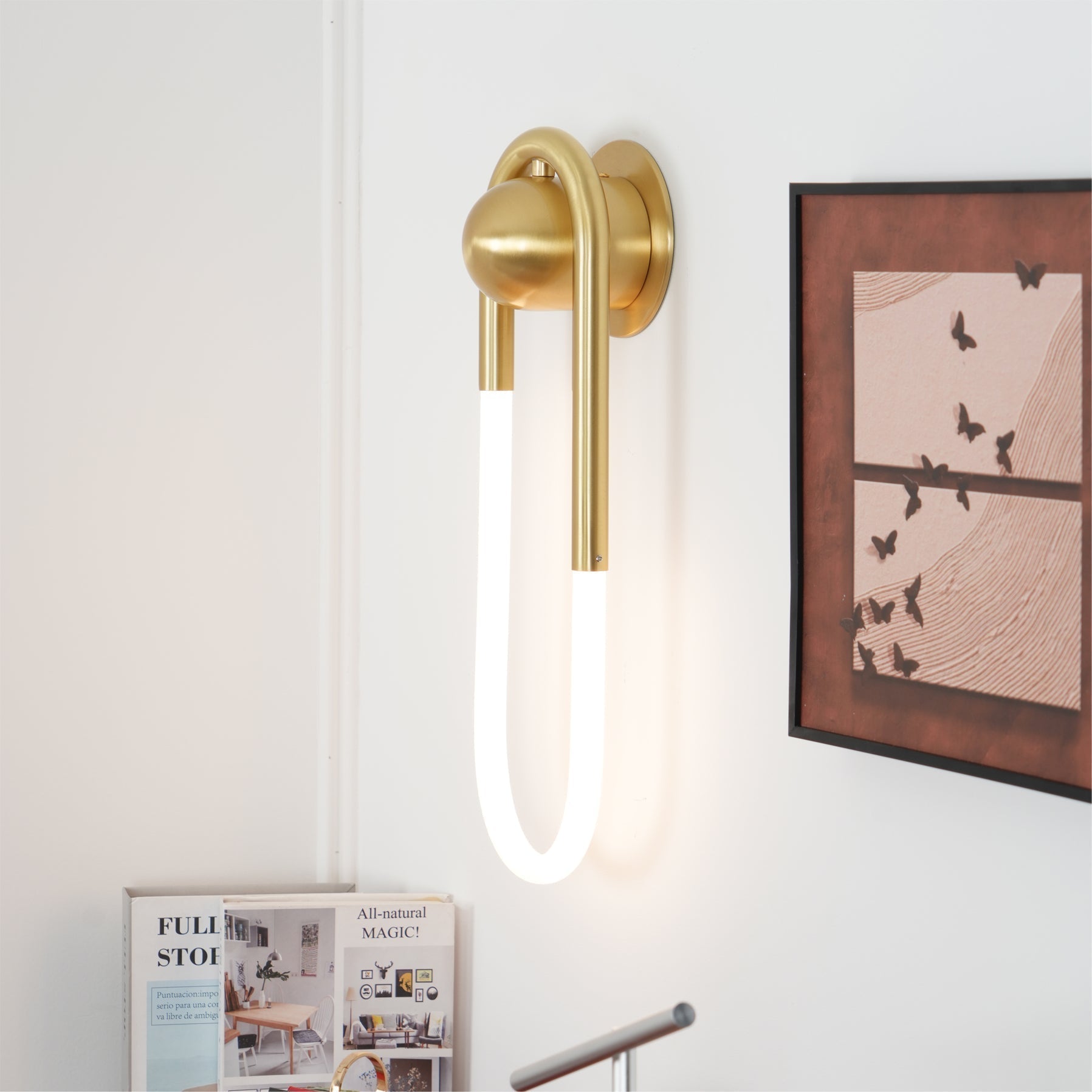The larger size Rudi Loop Wall Lamp in a hallway setting.