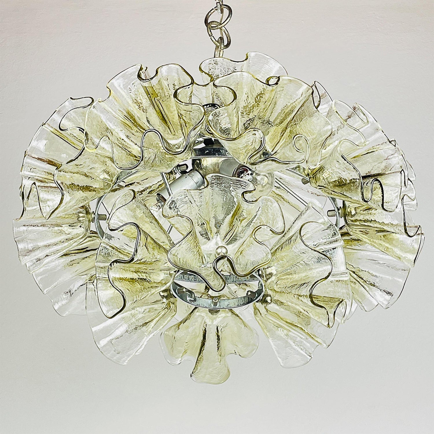 The orbital metal framework of the Ruffled Petal Chandelier.